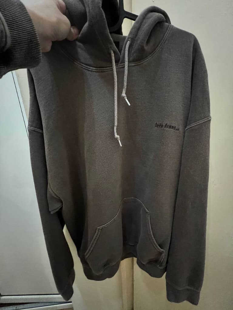 Brown hoodie photographed at home