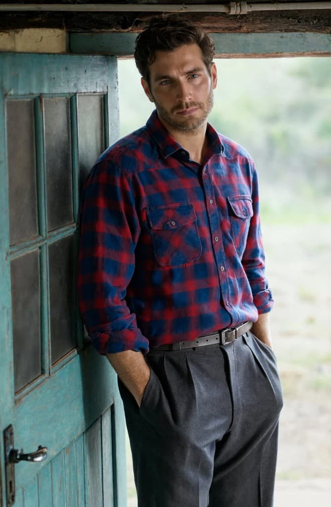 Plaid shirt worn in a doorway